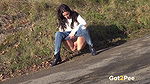 Ali Bordeaux pees on a road in the suburbs