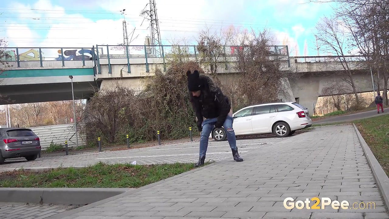 Ali Bordeaux squats and pees in a car park