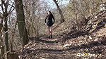 Amanda Hill squats to piss in the woodland