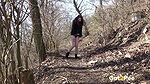 Amanda Hill squats to piss in the woodland