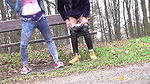 Best friends squat and piss on the ground outside