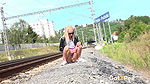 Blonde babe Debora pees next to railway line