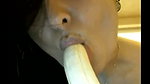 naughty indian babe sucking a banana on camera