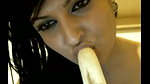 naughty indian babe sucking a banana on camera