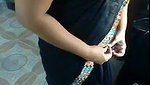 Indian aunty showing how to put on a sari