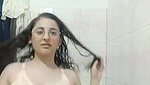 Pakistani girl in bathroom showing milk jugs