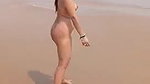 Naughty rich Indian milf walking nude on beach