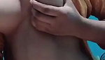 teen girl pressing own boobs