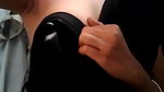 girl pressing own boob