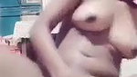 pressing own boob