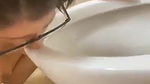 beautiful girl licking toilet seat
