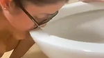 beautiful girl licking toilet seat