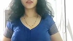 busty MILF removing blouse and showing big boobs