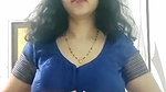 busty MILF removing blouse and showing big boobs