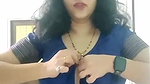 busty MILF removing blouse and showing big boobs