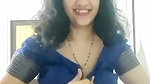 busty MILF removing blouse and showing big boobs