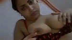 beautiful girl playing with her big round boobs