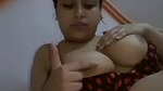 beautiful girl playing with her big round boobs