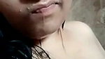 Indian girl showing boobs while bathing nude