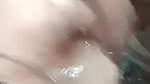 Indian girl showing boobs while bathing nude