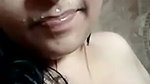 Indian girl showing boobs while bathing nude