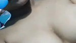 cute girl showing her big round boobs