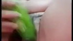 using a big cucumber to satisfy her needs