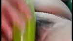 using a big cucumber to satisfy her needs
