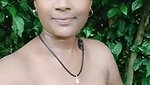 Indian women bathing outside