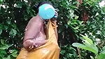Indian women bathing outside