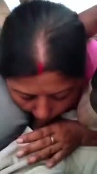 Mature aunty sucking dick on runing car