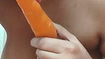 Hot girl showing her nude body and sucking carrot