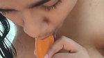Hot girl showing her nude body and sucking carrot