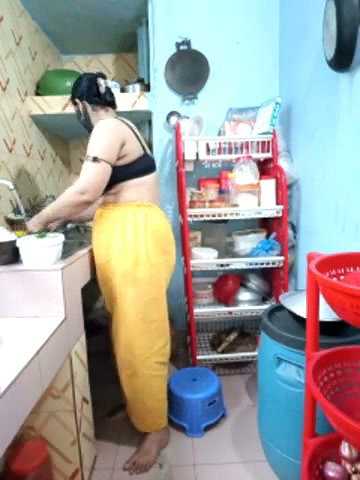 Hot girl working on kitchen and show her huge boobs