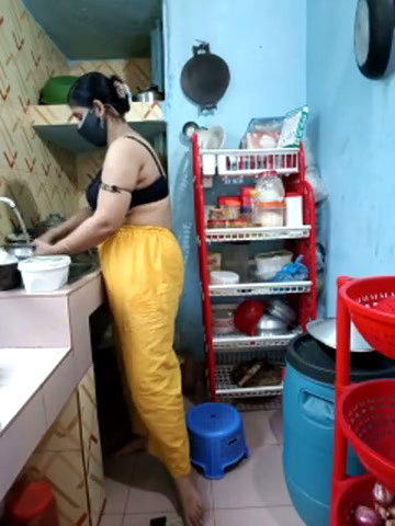 Hot girl working on kitchen and show her huge boobs