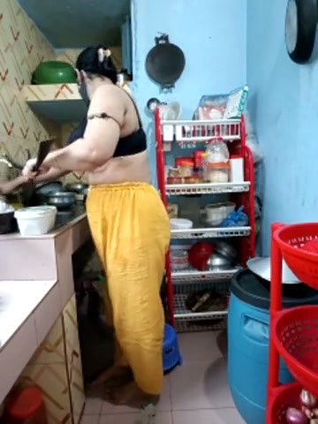 Hot girl working on kitchen and show her huge boobs