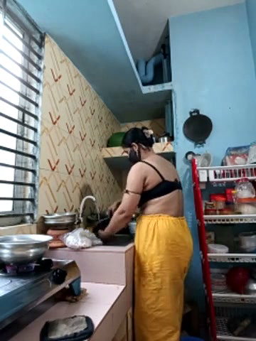 Hot girl working on kitchen and show her huge boobs
