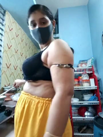 Hot girl working on kitchen and show her huge boobs