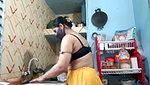 Hot girl working on kitchen and show her huge boobs