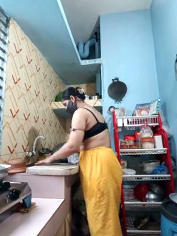 Hot girl working on kitchen and show her huge boobs