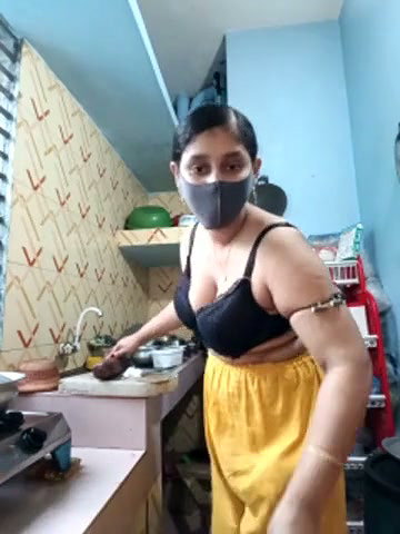 Hot girl working on kitchen and show her huge boobs