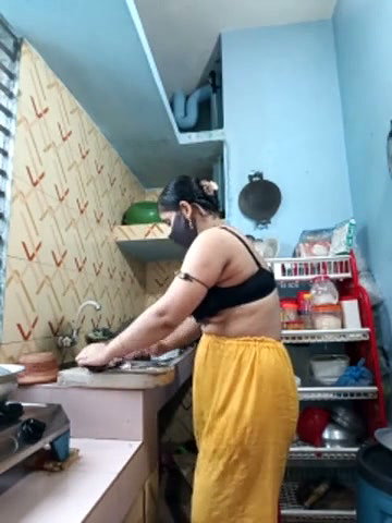 Hot girl working on kitchen and show her huge boobs
