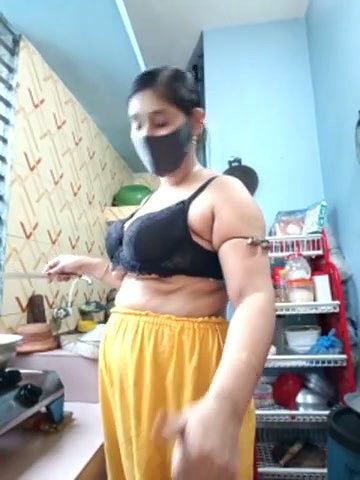 Hot girl working on kitchen and show her huge boobs