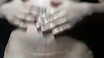 Beautiful girl applying oil on her nude body