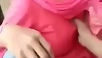 Boyfriend pressing girlfriend boob outdoor