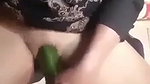 village girl inserting cucumber
