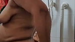 Mature lady bathing  wearing cloth