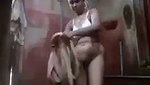 Tamil girl taking bath  wearing cloth