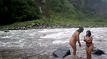 Two bhabhi talking bath in open area