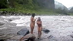 Two bhabhi talking bath in open area